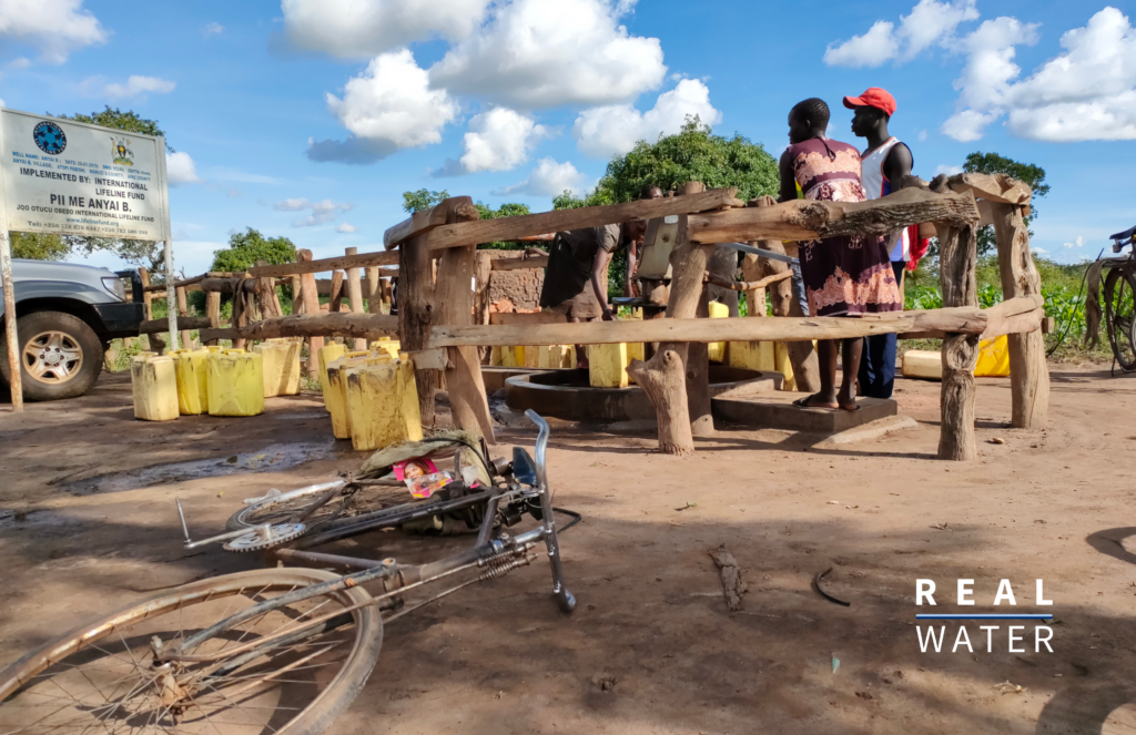 A group of people collecting water from a handpump in Northern Uganda.