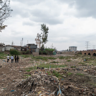 Dorice Moseti a volunteer with Slum Dwellers International Kenya, guides Irene Atieno and Faith Chepngeno social workers with Aquaya Kenya, through Mukuru slums as they undertake their mapping exercise for Google Artificial Intelligence project. Mukuru slums Nairobi Kenya. 14th September, 2022