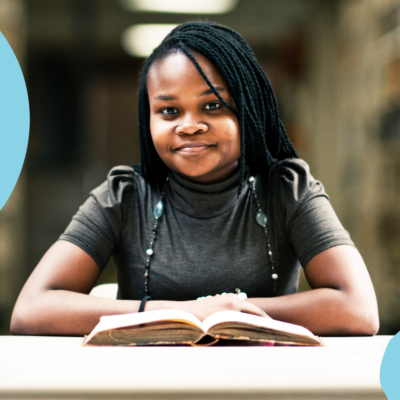 African student reading a book.