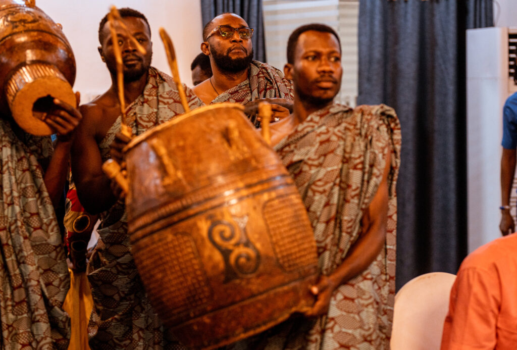Cultural groups beat drums to usher dignities. The drums signify that important personnel will be hosting the Assurance Fund launch.