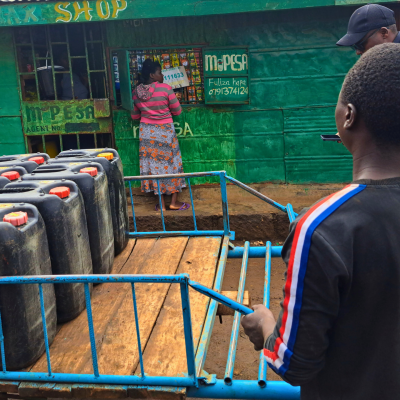 water vendor standing in front of a store in nairobi